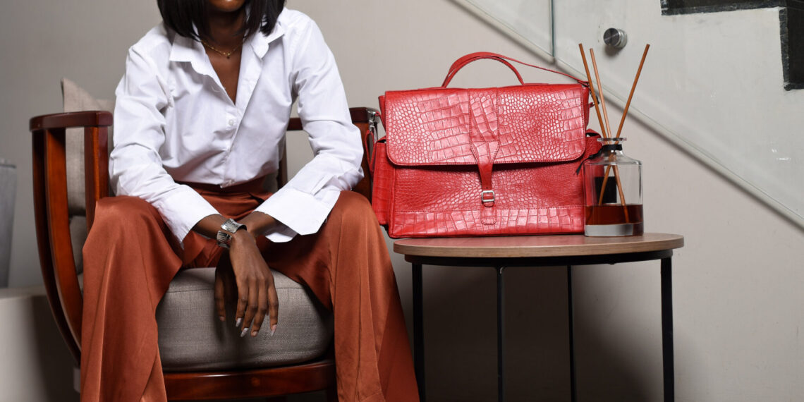 Nigerian artisan crafting quality leather goods in Aba workshop, representing local manufacturing excellence and economic growth through buying Nigerian products