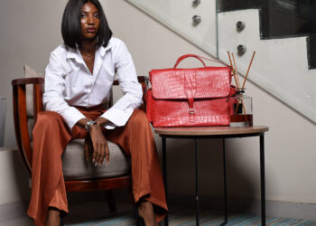 Nigerian artisan crafting quality leather goods in Aba workshop, representing local manufacturing excellence and economic growth through buying Nigerian products