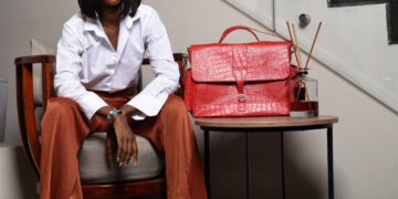 Nigerian artisan crafting quality leather goods in Aba workshop, representing local manufacturing excellence and economic growth through buying Nigerian products